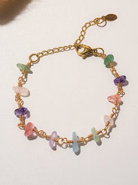 Chinese Tea House Bracelet overhead flat lay showing wire wrapped rose quartz amethyst green aventurine aquamarine fluorite purple jade crystal chips on gold chain, handmade healing crystal bracelet Sri Lanka – Laganna