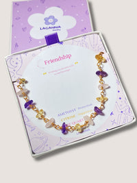 Laganna handmade friendship bracelet with amethyst, citrine and rose quartz for balance and positivity on jewelry card and box