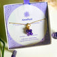 Beautiful amethyst clover necklace in aesthetic jewelry box presentation, featuring the lucky clover-shaped purple gemstone with gold wire wrapping - artisan-crafted healing crystal jewelry handmade in Sri Lanka by Laganna for peace and balance