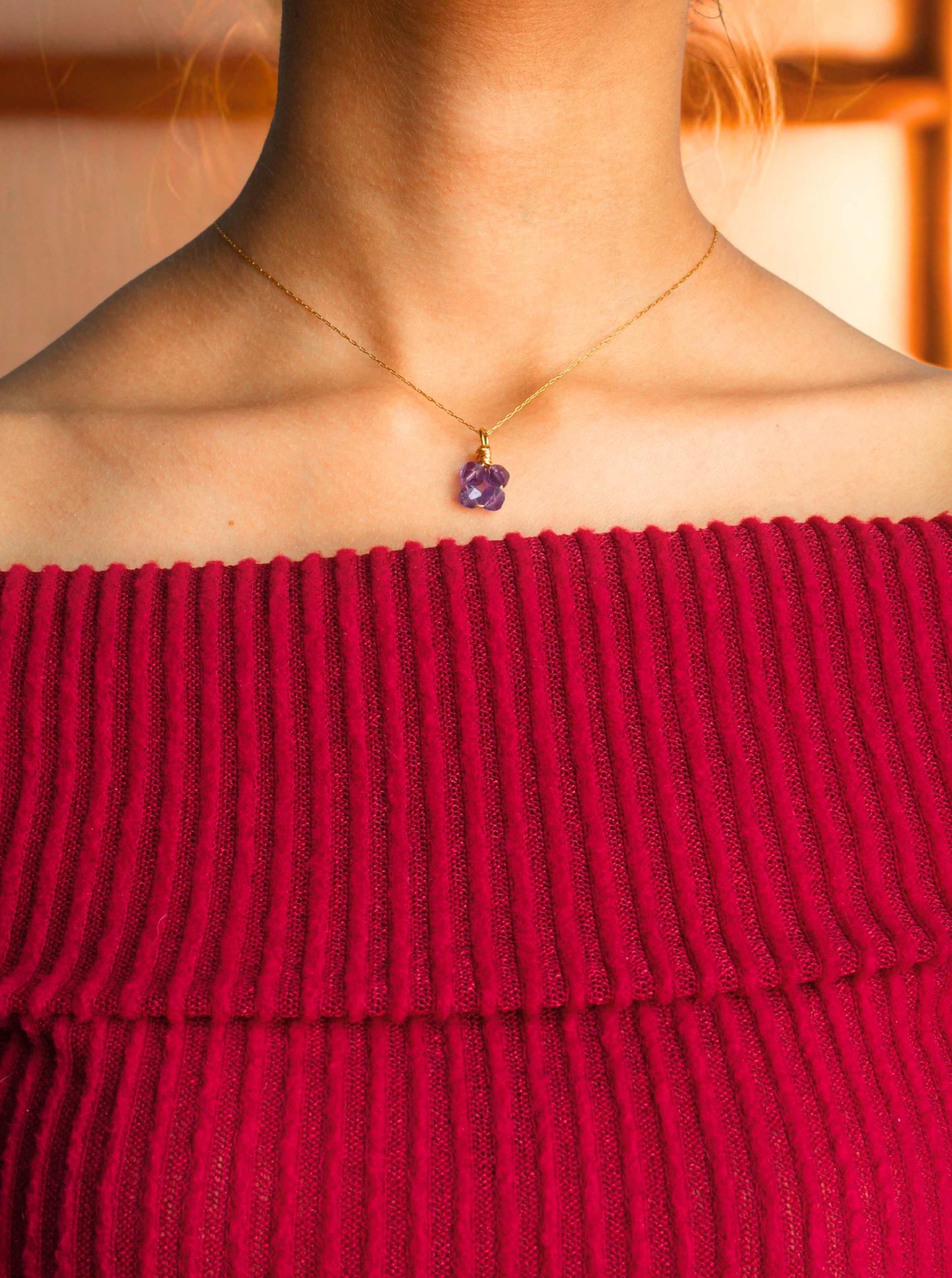 Elegant amethyst clover pendant necklace worn gracefully, showcasing the beautiful purple gemstone in delicate gold wire wrapped design - handmade healing crystal jewelry from Sri Lanka for emotional healing and spiritual clarity