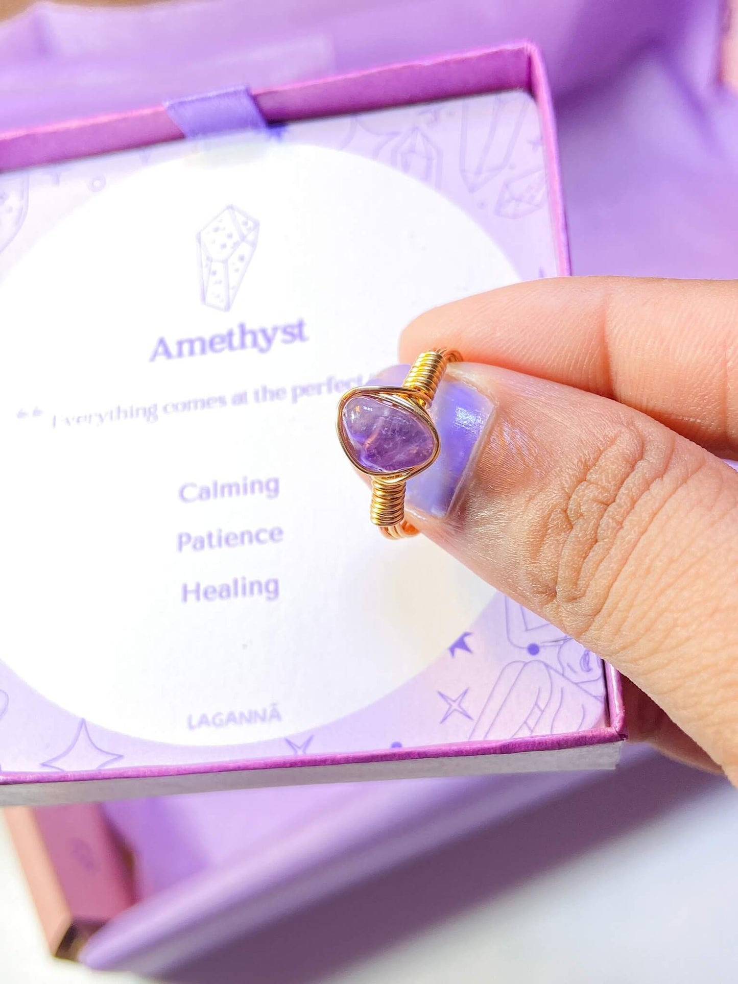 Amethyst irregular stone ring jewelry box held in hand showing handmade gold wire wrapped healing crystal gift set, Sri Lankan artisan spiritual ring featuring natural purple gemstone perfect as third eye chakra jewelry gift for stress relief and meditation practice