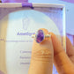 Amethyst irregular stone ring in silver wire wrapped design with jewelry box held in hand showing handmade healing crystal gift set, Sri Lankan artisan spiritual ring featuring natural purple gemstone perfect as third eye chakra jewelry gift for stress relief and spiritual awakening