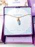 Aquamarine irregular stone necklace jewelry box front view showing gold wire wrapped design, handmade Sri Lankan healing crystal pendant for clarity and calm