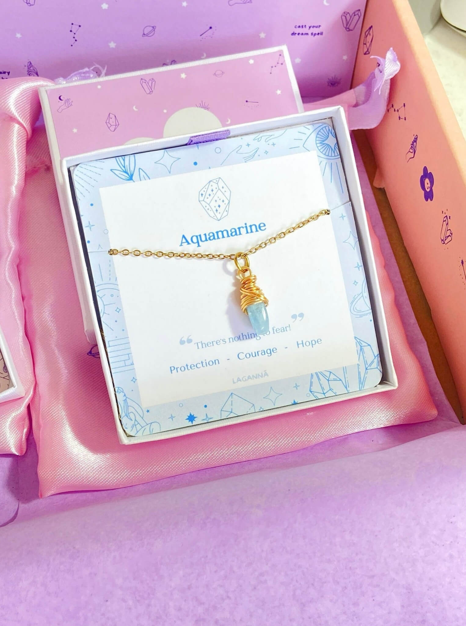 Aquamarine irregular stone necklace in gold wire wrap with jewelry box packaging, handmade Sri Lankan healing crystal pendant for throat chakra and communication