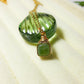 Olive jade square stone necklace in gold wire wrapped design showing handmade healing crystal jewelry, Sri Lankan artisan heart chakra pendant featuring natural square green gemstone perfect as boho abundance necklace and prosperity amulet for emotional balance and inner peace with geometric styling