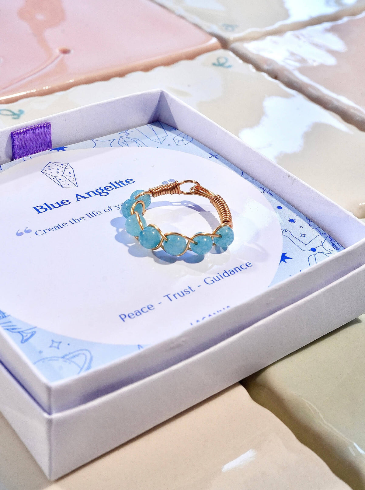 Blue Angelite Braided Ring gold wire wrapped blue stone beads in Laganna gift box blue card Peace Trust Guidance, handmade healing crystal ring Sri Lanka Laganna
