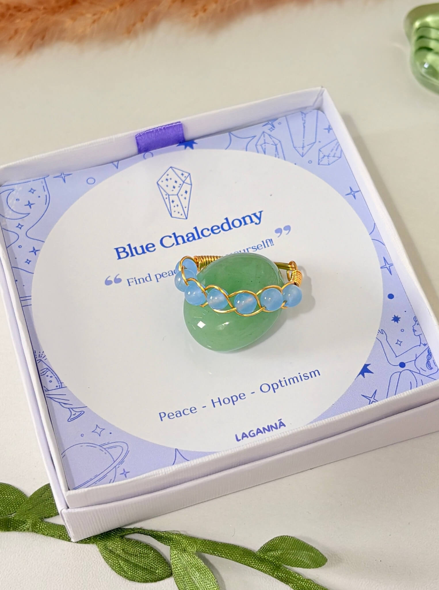 Blue Chalcedony Braided Ring with gold wire in Laganna gift box with crystal meaning card showing Peace Hope Optimism, handmade healing crystal ring for calm and inner peace, Sri Lanka