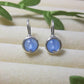 Pair of Blue Chalcedony Petite Round Stud Earrings with soft sky blue stones in wire-wrapped gold and silver settings - handmade crystal healing jewelry crafted in Sri Lanka for calm and inner peace