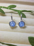 Pair of Blue Chalcedony Petite Round Stud Earrings with soft sky blue stones in wire-wrapped gold and silver settings - handmade crystal healing jewelry crafted in Sri Lanka for calm and inner peace
