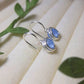 Blue Chalcedony Petite Round Stud Earrings showing delicate size and natural blue stone glow - handcrafted wire-wrapped crystal jewelry from Sri Lanka for peaceful energy
