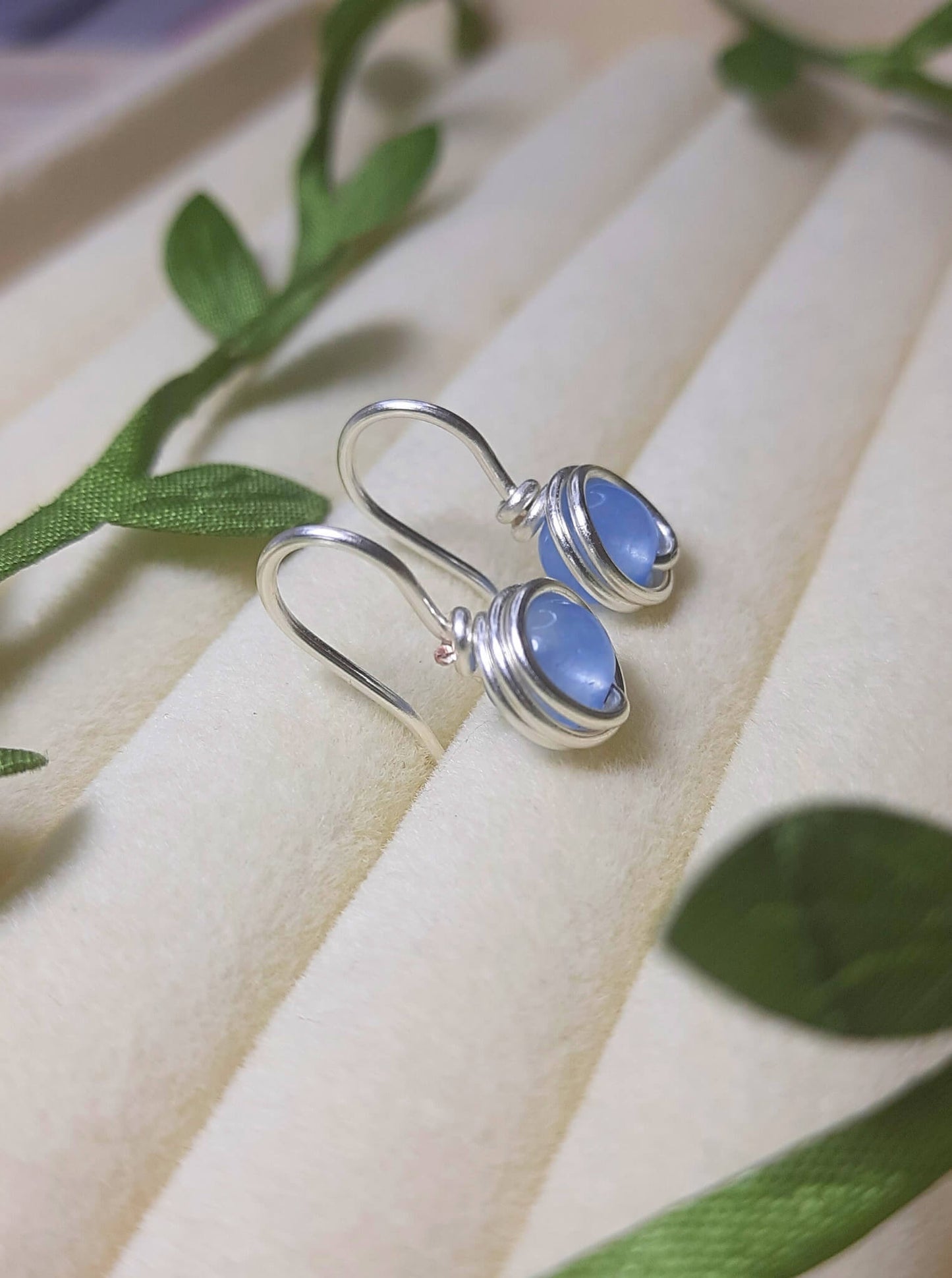 Blue Chalcedony Petite Round Stud Earrings showing delicate size and natural blue stone glow - handcrafted wire-wrapped crystal jewelry from Sri Lanka for peaceful energy
