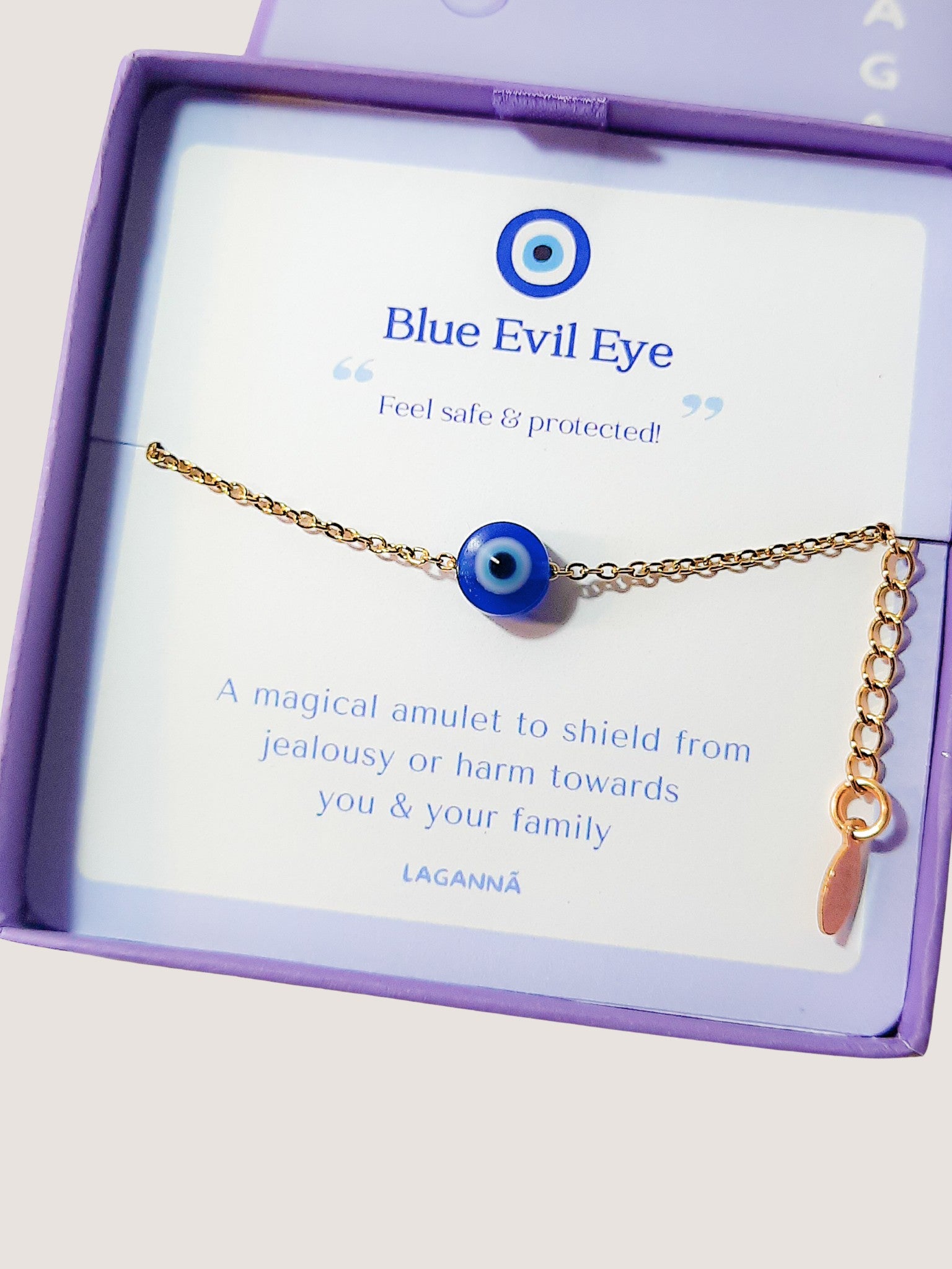 Blue evil eye bracelet in elegant Laganna jewelry box showing handmade gold protection bracelet packaging, Sri Lankan artisan spiritual jewelry gift set featuring wire wrapped healing crystal bracelet as evil eye talisman with premium presentation