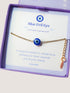Blue evil eye bracelet in elegant Laganna jewelry box showing handmade gold protection bracelet packaging, Sri Lankan artisan spiritual jewelry gift set featuring wire wrapped healing crystal bracelet as evil eye talisman with premium presentation