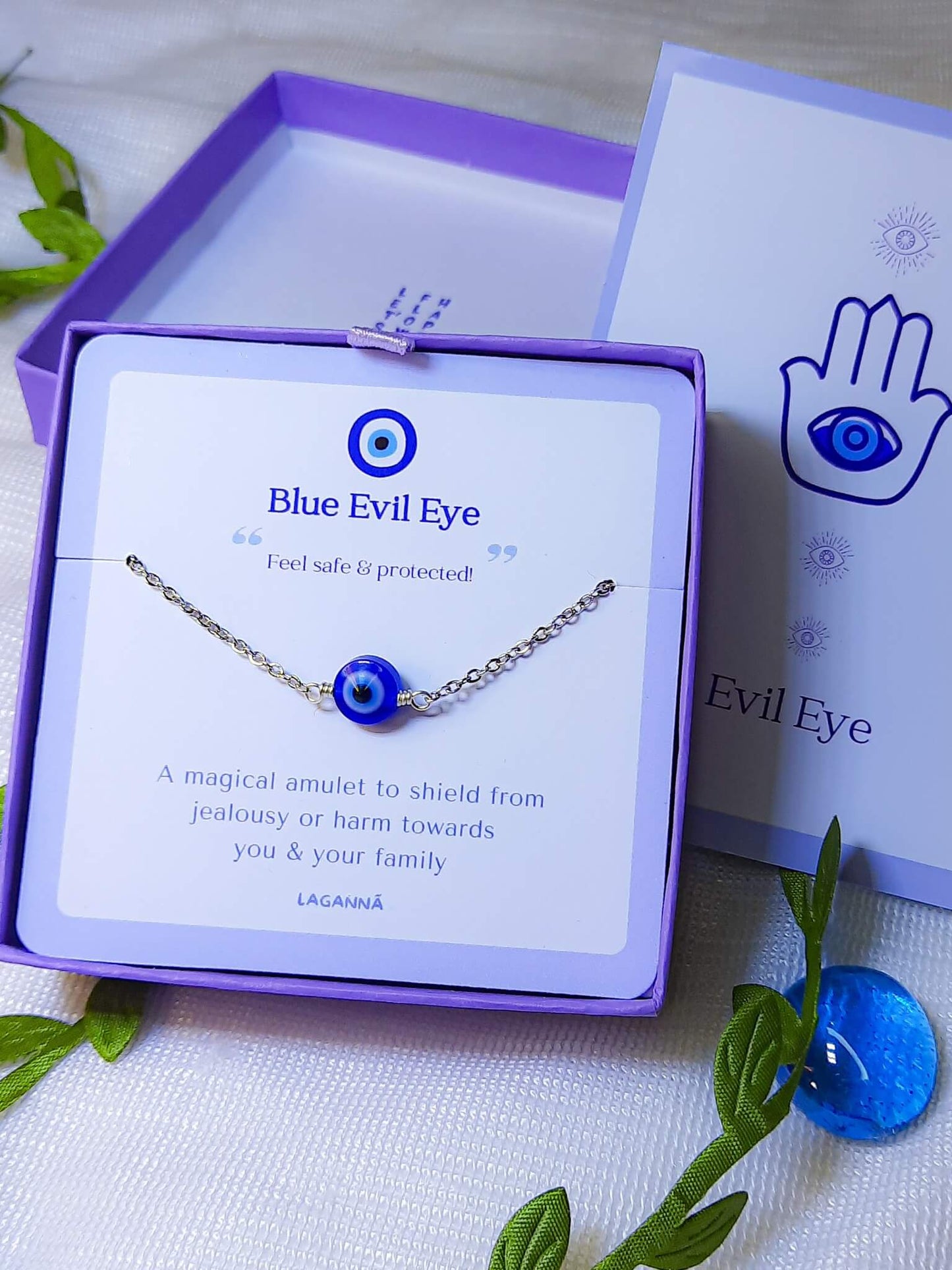 Blue evil eye silver bracelet with Laganna packaging showing handmade protection bracelet gift set, Sri Lankan spiritual jewelry featuring wire wrapped healing crystal design perfect as boho evil eye talisman and protective amulet for metaphysical jewelry lovers