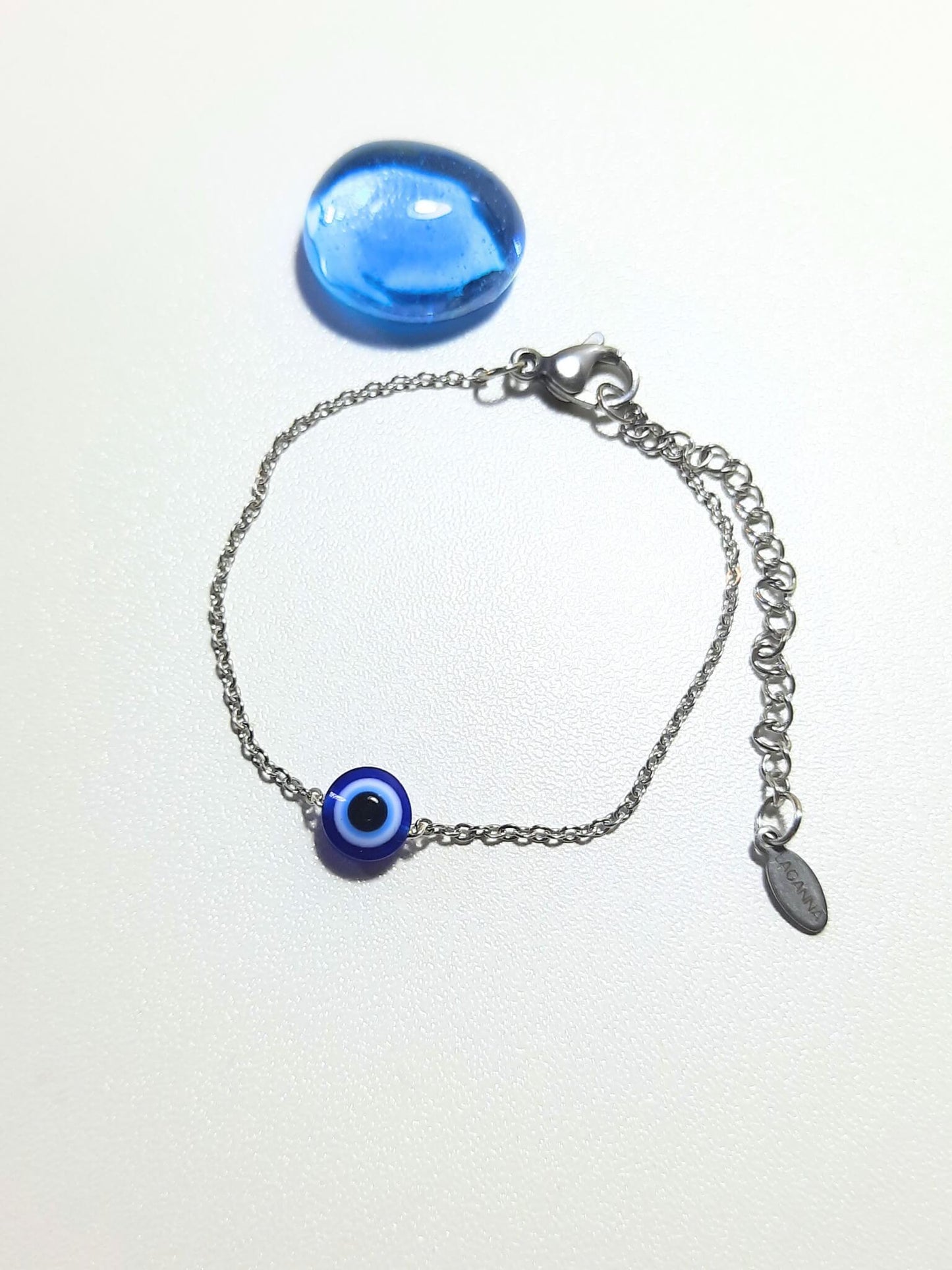 Handmade blue evil eye protection bracelet in adjustable silver wire wrapped design, featuring spiritual healing crystal jewelry crafted by Sri Lankan artisans as protective talisman and boho chic amulet for women seeking luck and anxiety relief