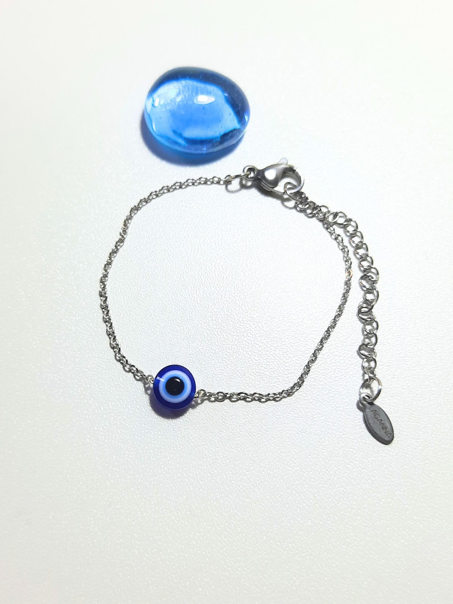 Handmade blue evil eye protection bracelet in adjustable silver wire wrapped design, featuring spiritual healing crystal jewelry crafted by Sri Lankan artisans as protective talisman and boho chic amulet for women seeking luck and anxiety relief