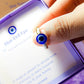 Blue evil eye seed bead ring jewelry box held on hand, handmade Sri Lankan gold wire wrapped protective talisman ring gift for spiritual protection