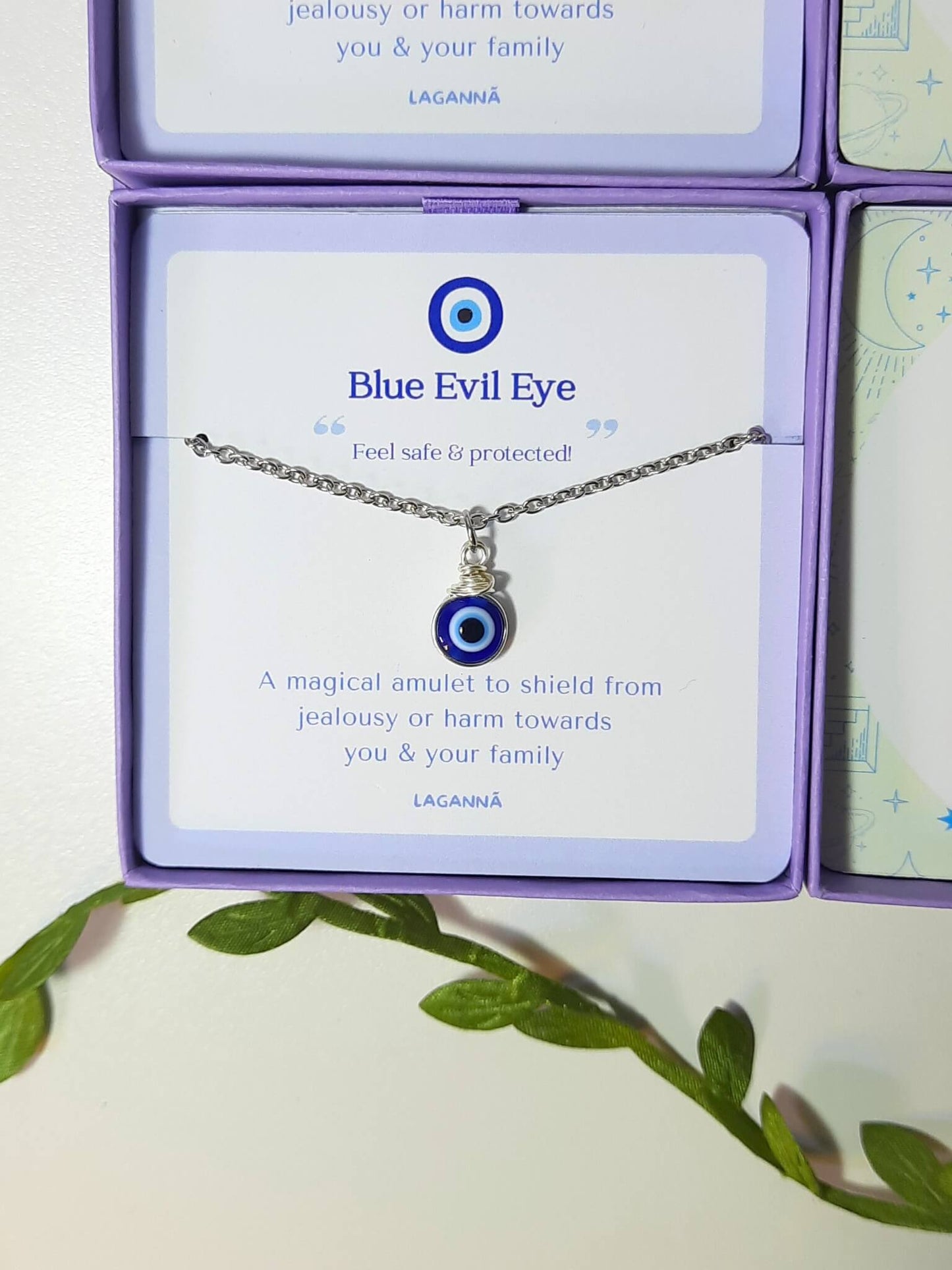 Handmade blue evil eye silver necklace in elegant jewelry box showing adjustable protection pendant, spiritual healing crystal jewelry crafted by Sri Lankan artisans as boho evil eye talisman and protective amulet for luck and anxiety relief with premium packaging