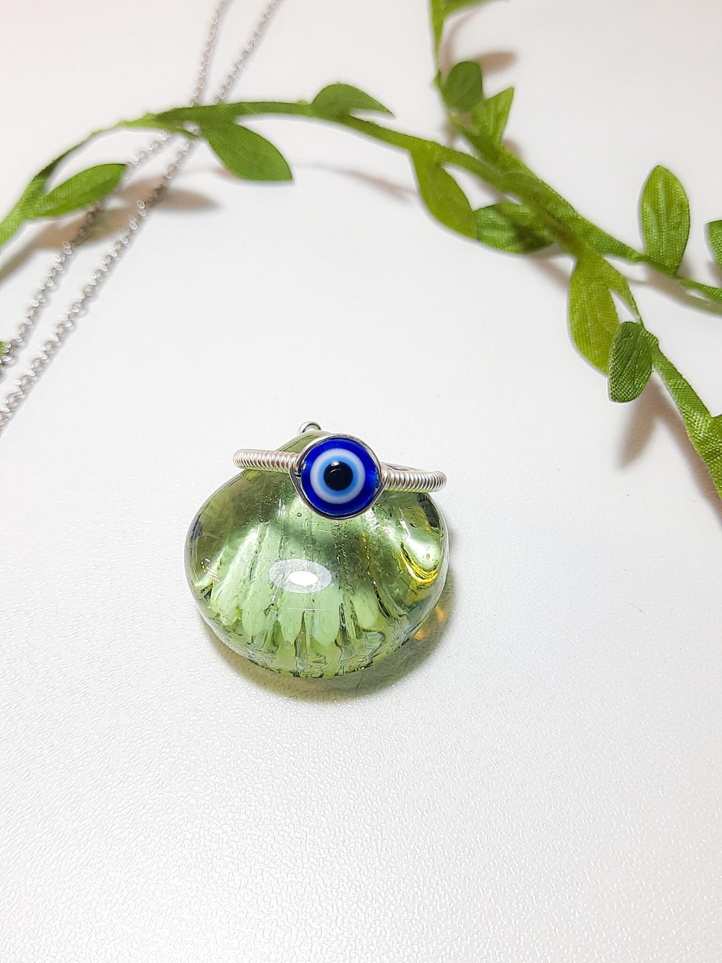 Handmade blue evil eye protection ring in adjustable silver wire wrapped design, featuring spiritual healing crystal jewelry crafted by Sri Lankan artisans as a protective talisman and boho chic amulet for women seeking anxiety relief and chakra balancing