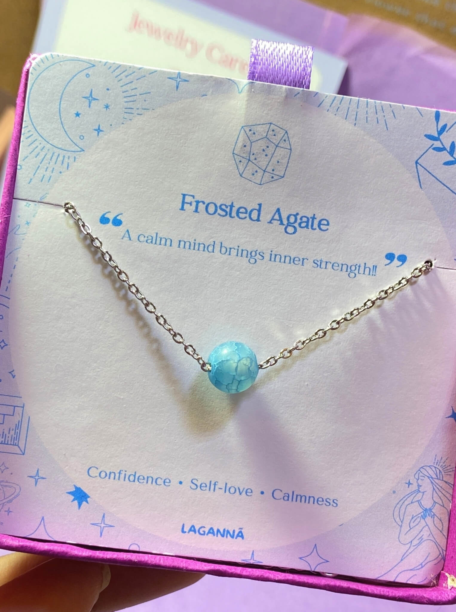 Blue Moon bracelet jewelry box held on hand showing frosted agate, handmade Sri Lankan silver wire wrapped healing crystal bracelet gift for emotional healing