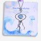 Blue Moon Jellyfish Necklace handmade stainless steel wire sculpted jellyfish pendant with Blue Chalcedony stone on Laganna packaging card white background artisan crafted Sri Lanka healing crystal jewelry calm clarity hope