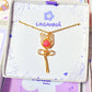 Stylish pink chalcedony rose pendant necklace in aesthetic flat lay styling, highlighting the minimalist gold wire wrapped design - handmade healing crystal jewelry from Sri Lanka for feminine accessory lovers