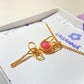 Detailed closeup of pink chalcedony rose pendant showing exquisite gold wire wrapping craftsmanship - handmade healing crystal jewelry by Sri Lankan artisans at Laganna, showcasing quality feminine gift details