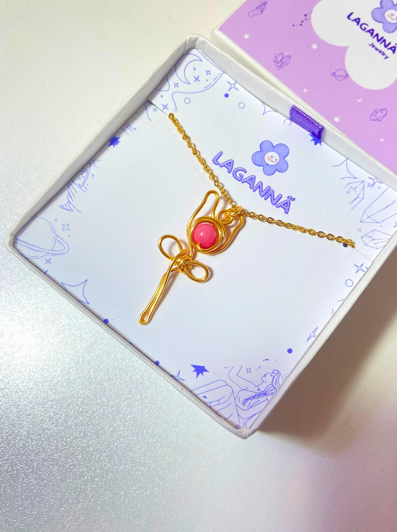 Beautiful blush rose pink chalcedony pendant necklace on clean white background, featuring delicate gold wire wrapping - artisan-crafted healing crystal jewelry handmade in Sri Lanka by Laganna, ideal feminine gift