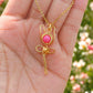 Elegant pink chalcedony rose pendant necklace presented on hand, showcasing minimalist gold wire wrapped design - handmade healing crystal jewelry from Sri Lanka for the modern feminine woman seeking self-love accessories