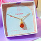 Carnelian drop necklace in elegant Laganna jewelry box packaging showing premium gift presentation, handmade gold wire wrapped healing crystal pendant featuring Sri Lankan artisan spiritual jewelry perfect as gemstone statement necklace gift for confidence creativity and protective energy with luxury packaging
