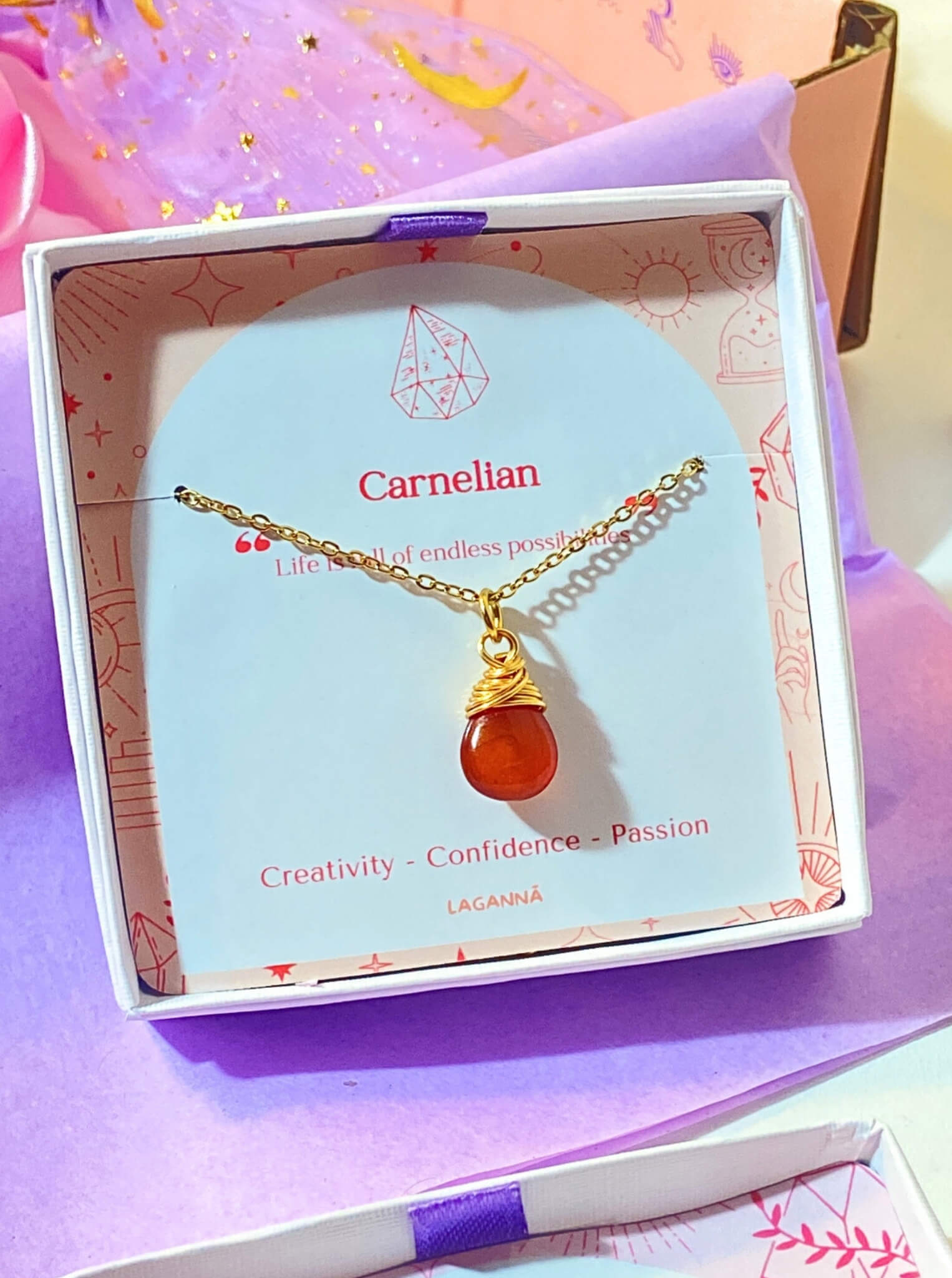 Carnelian drop necklace in elegant Laganna jewelry box packaging showing premium gift presentation, handmade gold wire wrapped healing crystal pendant featuring Sri Lankan artisan spiritual jewelry perfect as gemstone statement necklace gift for confidence creativity and protective energy with luxury packaging
