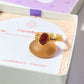 Handmade carnelian irregular stone ring in gold wire wrapped design on elegant jewelry box featuring natural healing crystal jewelry crafted by Sri Lankan artisans as creativity stone ring and sacral chakra balancing amulet for women seeking courage and motivation with raw orange gemstone energy