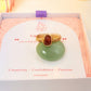 Carnelian Irregular Stone Ring gold wire wrapped displayed on green stone in Laganna jewelry box, handmade healing crystal ring Sri Lanka – creativity confidence passion