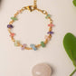 Chinese Tea House Bracelet rose quartz amethyst green aventurine aquamarine fluorite crystal chips gold wire bracelet overhead flat lay with green leaves and rose quartz stone prop, handmade healing crystal bracelet Sri Lanka – Laganna
