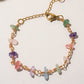 Chinese Tea House Bracelet overhead flat lay showing wire wrapped rose quartz amethyst green aventurine aquamarine fluorite purple jade crystal chips on gold chain, handmade healing crystal bracelet Sri Lanka – Laganna
