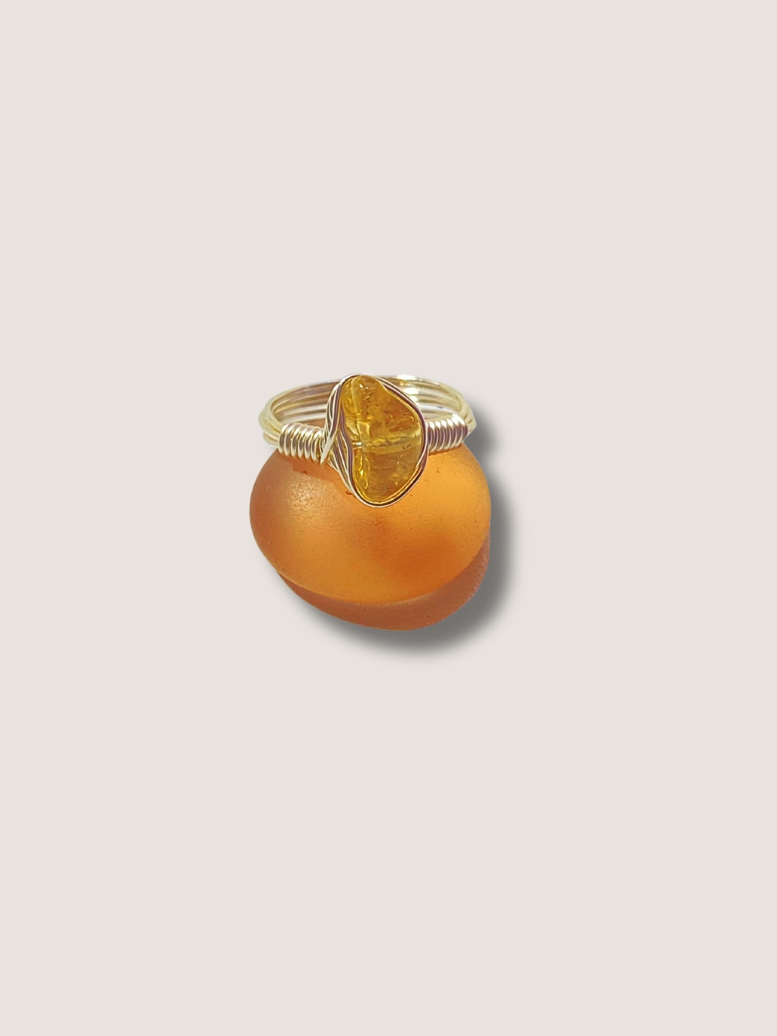 Citrine irregular stone ring on white background showing handmade gold wire wrapped healing crystal jewelry, Sri Lankan artisan abundance ring featuring natural yellow gemstone perfect as boho prosperity ring and solar plexus chakra amulet for confidence and manifestation energy enhancement