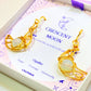 Detailed view of Crescent Moon Dangle Earrings with iridescent Opalite stones, handmade gold wire wrapped celestial jewelry from Sri Lanka by Laganna - premium healing crystal bohemian earrings