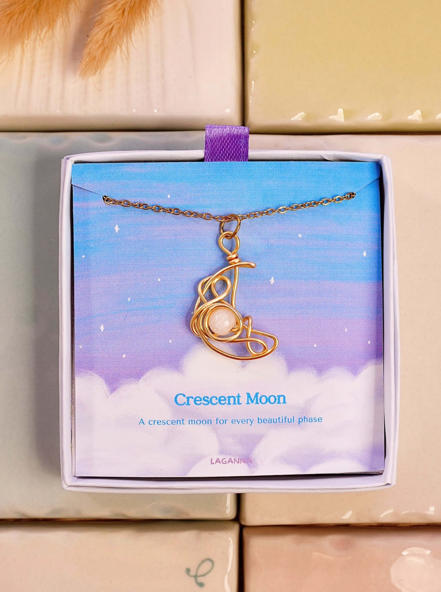 Crescent Moon Necklace Moonstone gold wire wrapped crescent pendant in Laganna gift box dreamy sky background, handmade healing crystal jewelry Sri Lanka Laganna