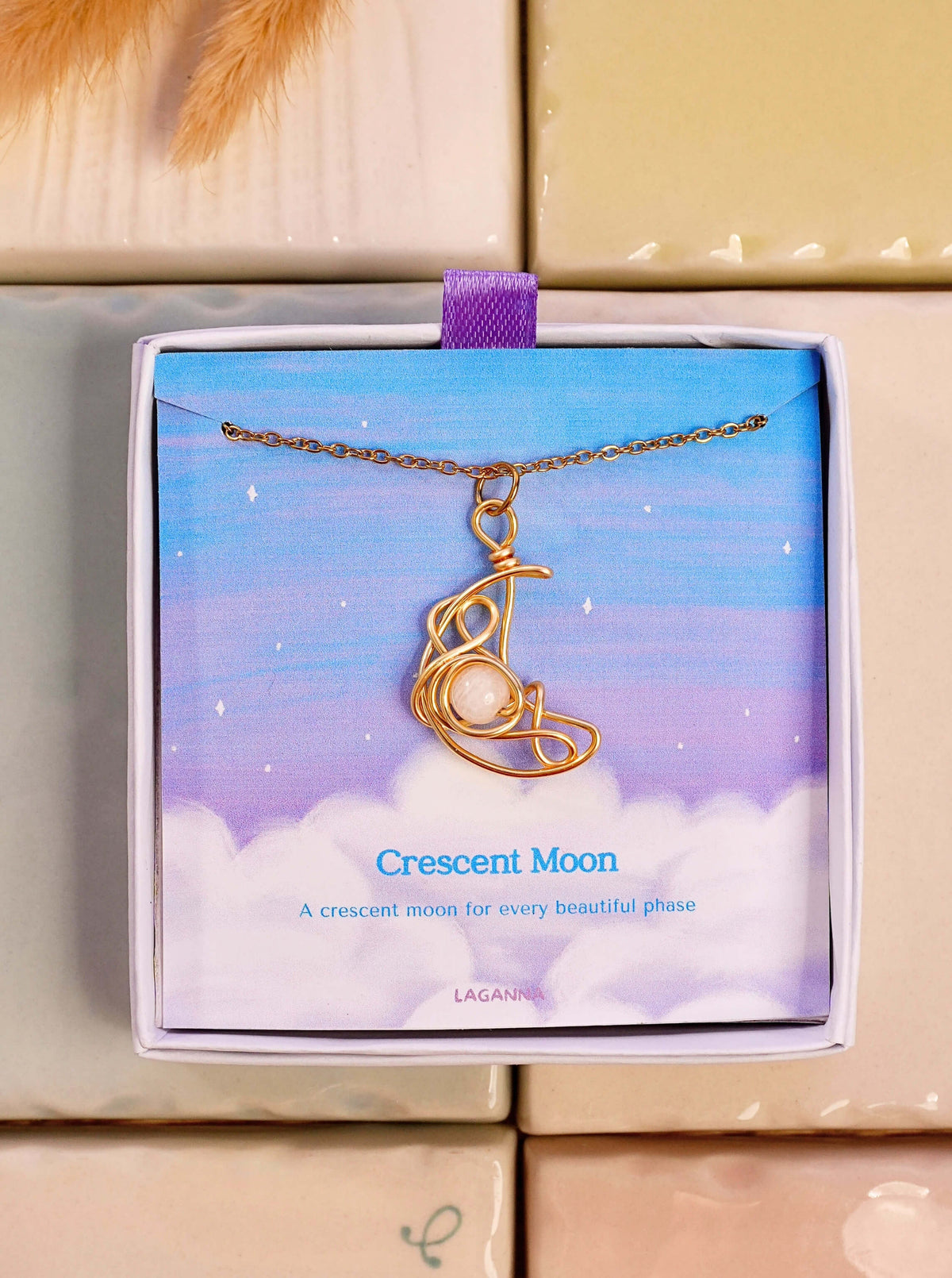 Crescent Moon Necklace Moonstone gold wire wrapped crescent pendant in Laganna gift box dreamy sky background, handmade healing crystal jewelry Sri Lanka Laganna
