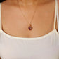 Handmade Red Chalcedony crimson heart pendant necklace with gold wire wrapping worn on model – devotion and passion crystal jewelry handcrafted in Sri Lanka, meaningful gift for her

