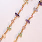 Close-up detail of Crystal Garden Eyeglass Chain showing wire wrapped amethyst green aventurine rose quartz and citrine healing crystal chips on gold chain, handmade jewelry Sri Lanka – Laganna