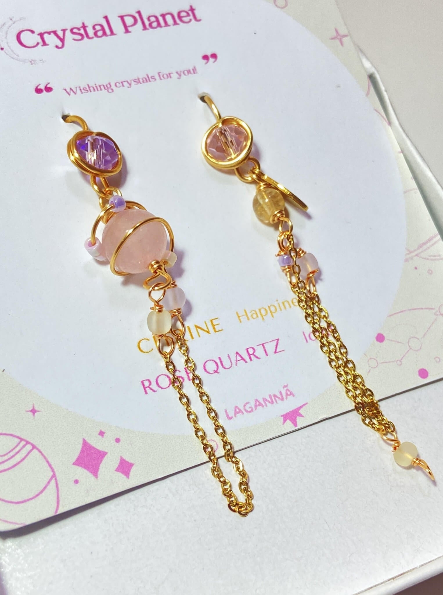 Crystal Planet mismatched dangle earrings jewelry box side view, handmade Sri Lankan rose quartz and citrine wire wrapped earrings for love and abundance energy