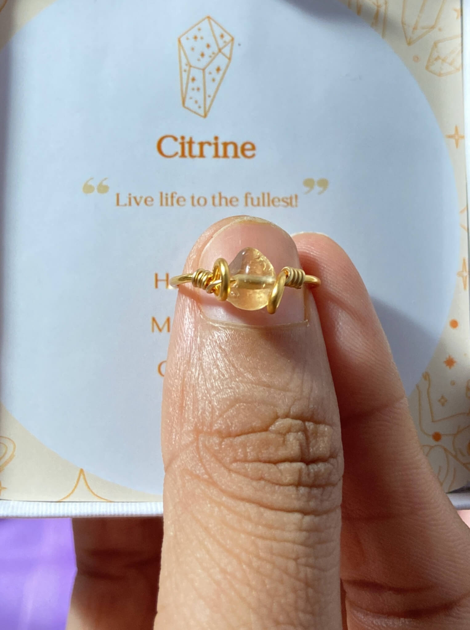 Dainty Irregular Citrine Ring worn on hand showing delicate wire-wrapped band and natural citrine stone - handcrafted healing crystal jewelry from Sri Lanka for motivation and positive energy

