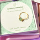 Dainty round green aventurine ring in gold wire wrap with jewelry box closeup, handmade Sri Lankan healing crystal ring for prosperity manifestation wealth luck opportunity stone