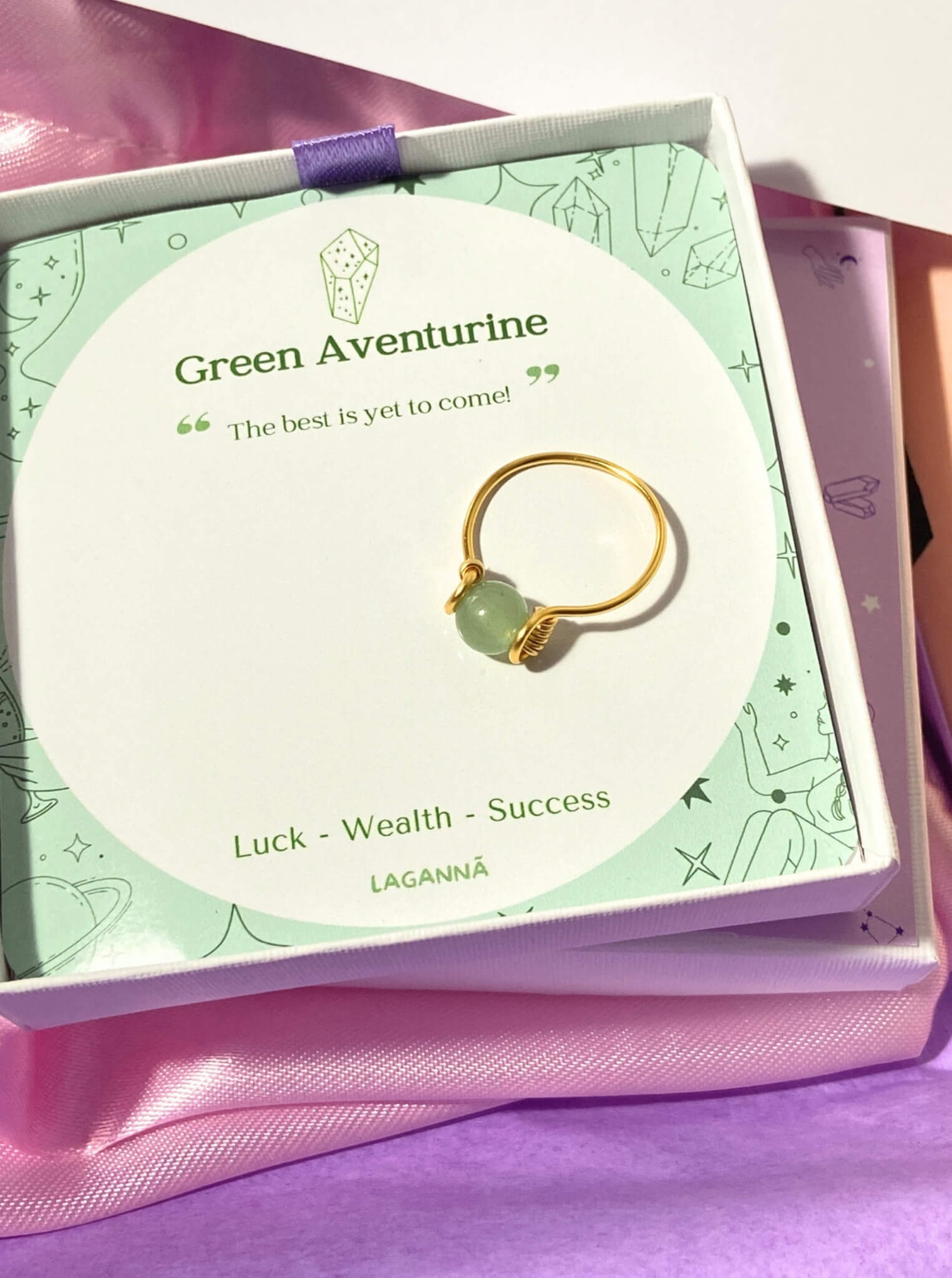 Dainty round green aventurine ring in gold wire wrap with jewelry box closeup, handmade Sri Lankan healing crystal ring for prosperity manifestation wealth luck opportunity stone