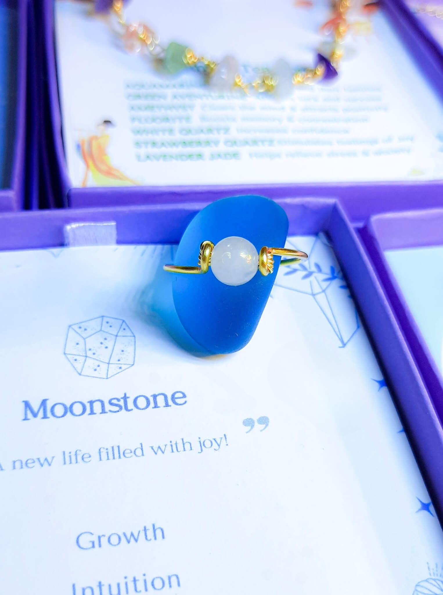 Dainty round moonstone ring jewelry box aesthetic styling, handmade Sri Lankan gold wire wrapped healing crystal ring for divine feminine and lunar energy