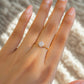 Laganna handmade dainty round moonstone gold wire wrapped ring for intuition and feminine energy worn on hand

