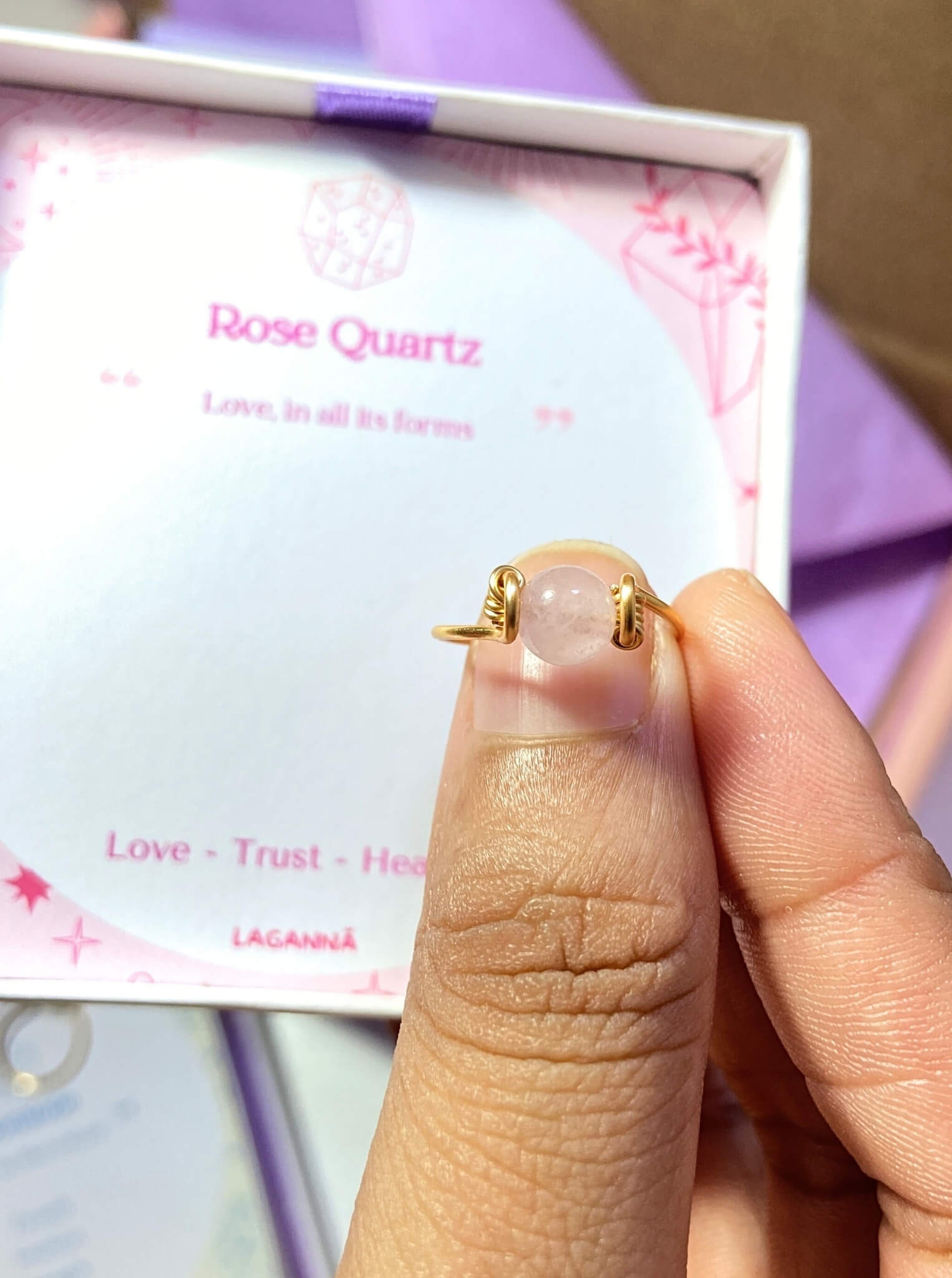 Dainty round rose quartz ring jewelry box held on hand, handmade Sri Lankan gold wire wrapped healing crystal ring gift for love and peace