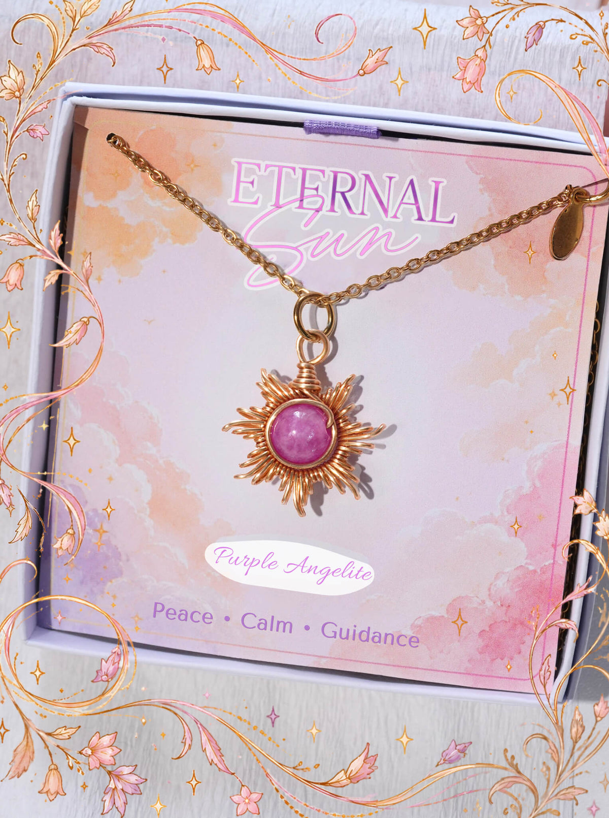 Purple Angelite Eternal Sun Necklace with a gold wire sun pendant in a Laganna gift box, displayed on its Peace, Calm, Guidance card with a floral border.
