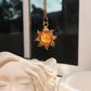 Eternal Sun Necklace Yellow Onyx gold wire wrapped sun pendant hanging near white goddess sculpture window light, handmade healing crystal jewelry Sri Lanka Laganna